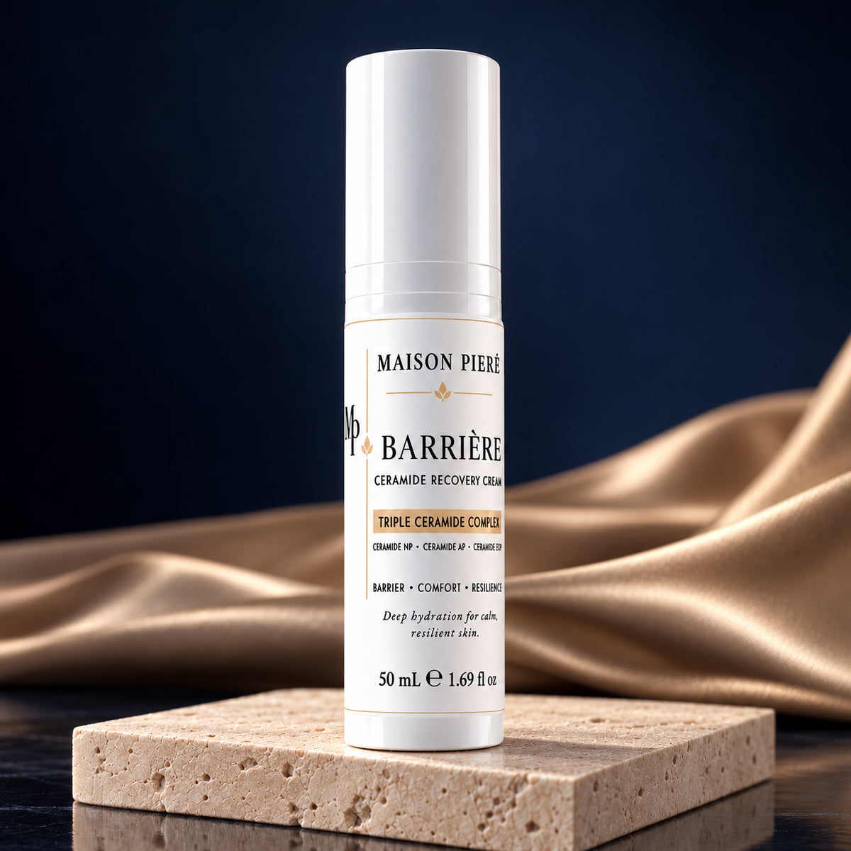 BARRIÈRE ceramide recovery cream, 50 mL, on ivory stone with champagne fabric and a midnight-blue background